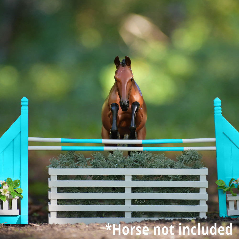 Breyer craftsmanship highlighted by hand-finished details on the wooden jump accessory.