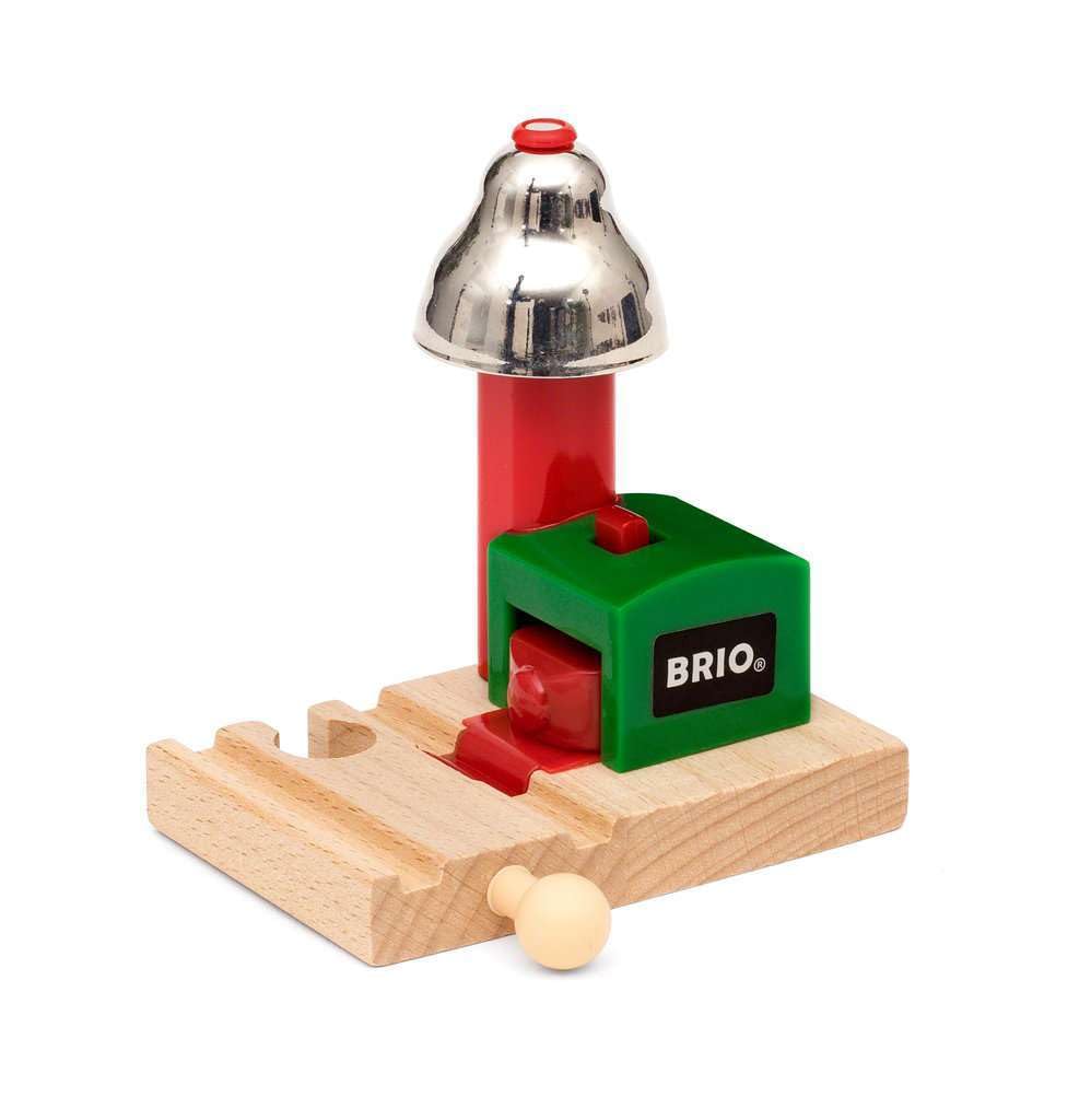 Close view of BRIO Magnetic Bell Signal green on track; enhances play with sound.
