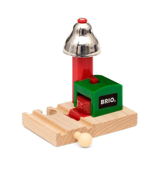 Close view of BRIO Magnetic Bell Signal green on track; enhances play with sound.