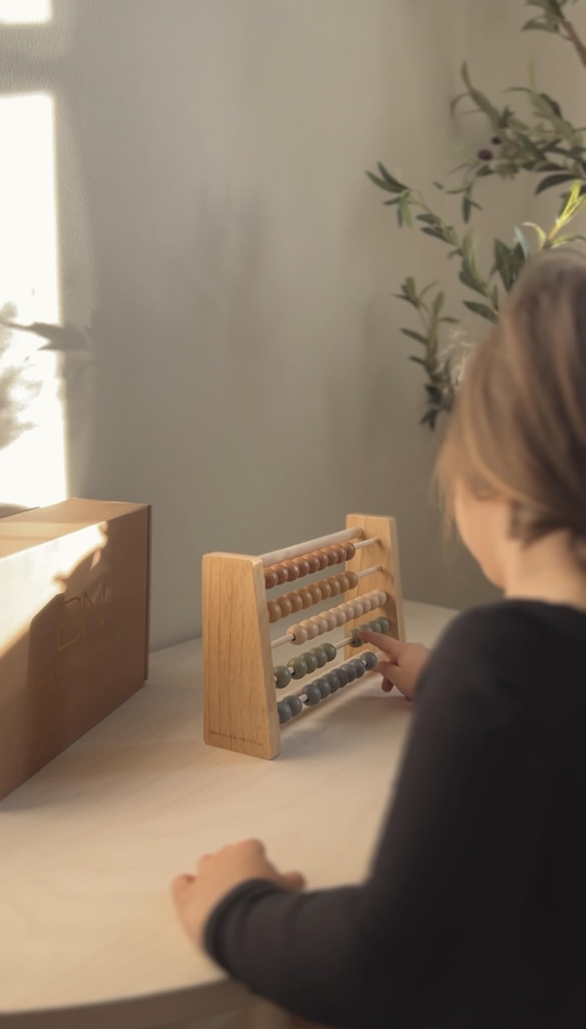 Brooklyn Neutral Boho Abacus decorative toy that doubles as learning aid.