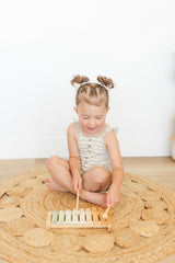 Brooklyn Neutral Xylophone in a nursery with a calm color palette