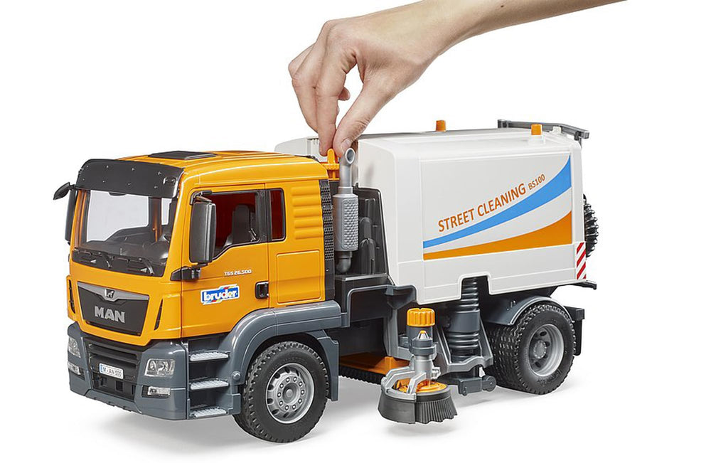 Bruder 03780 Man TGS Street Sweeper under-body long brush for continuous surface cleaning.