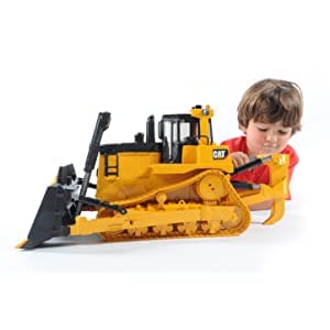 Bruder CAT Large Track-Type Tractor outdoors with sandbox or yard play potential.