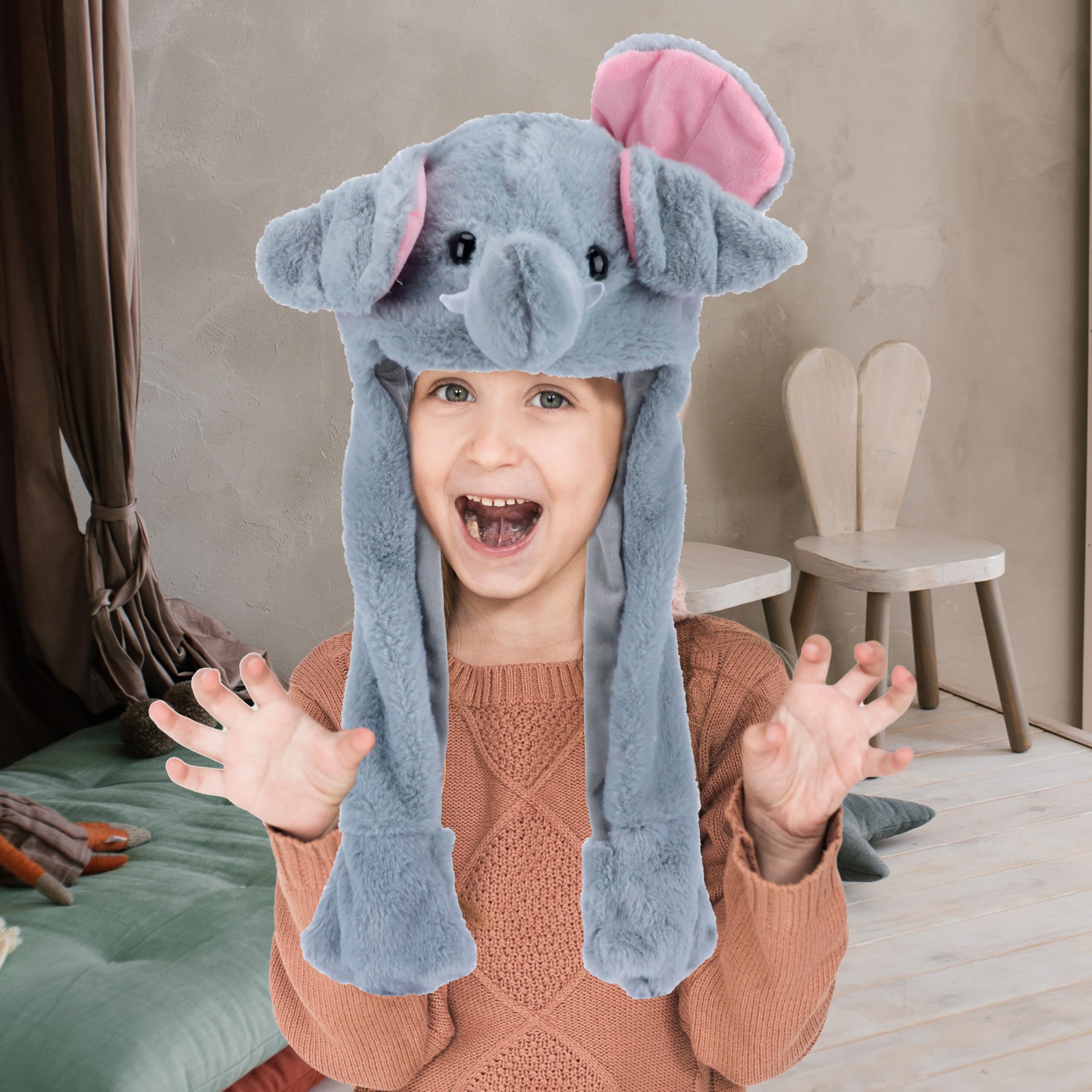 Bubblepompom elephant hat keeps kids warm during outdoor adventures.