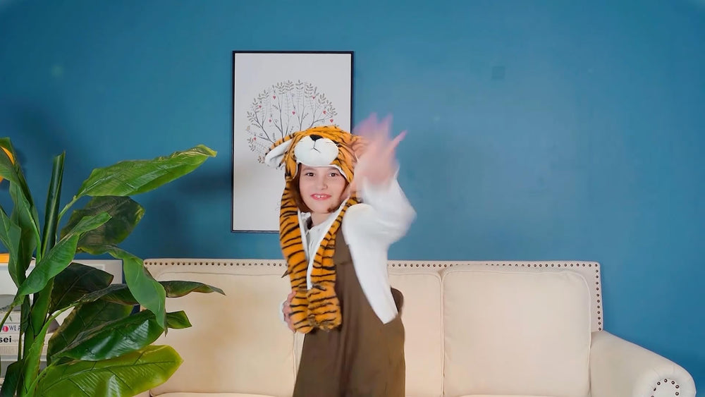 Bubblepompom tiger hat worn by a child for a cheerful cosplay look.
