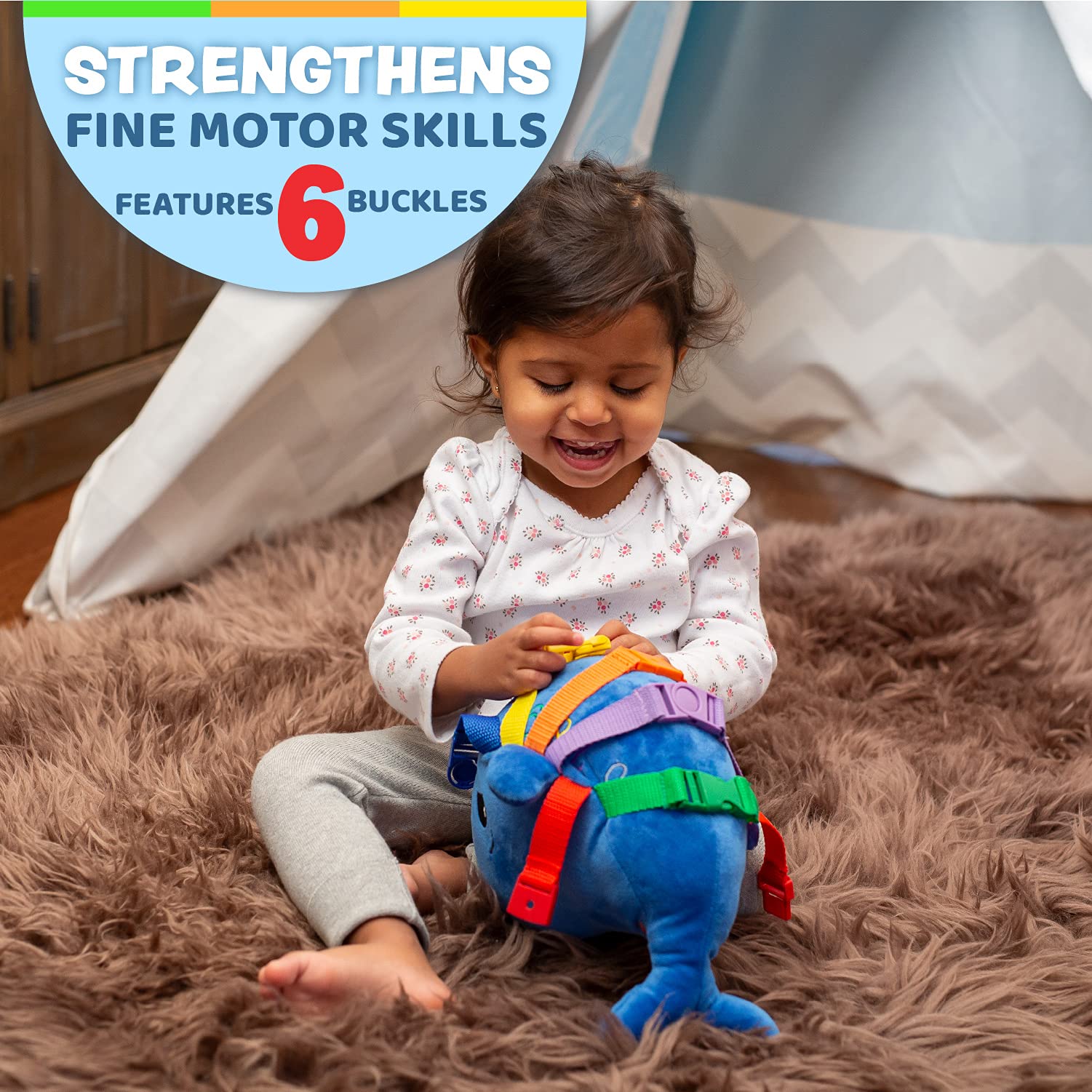 Blu Whale's zipper pocket invites interactive play and fine motor exploration on the go.