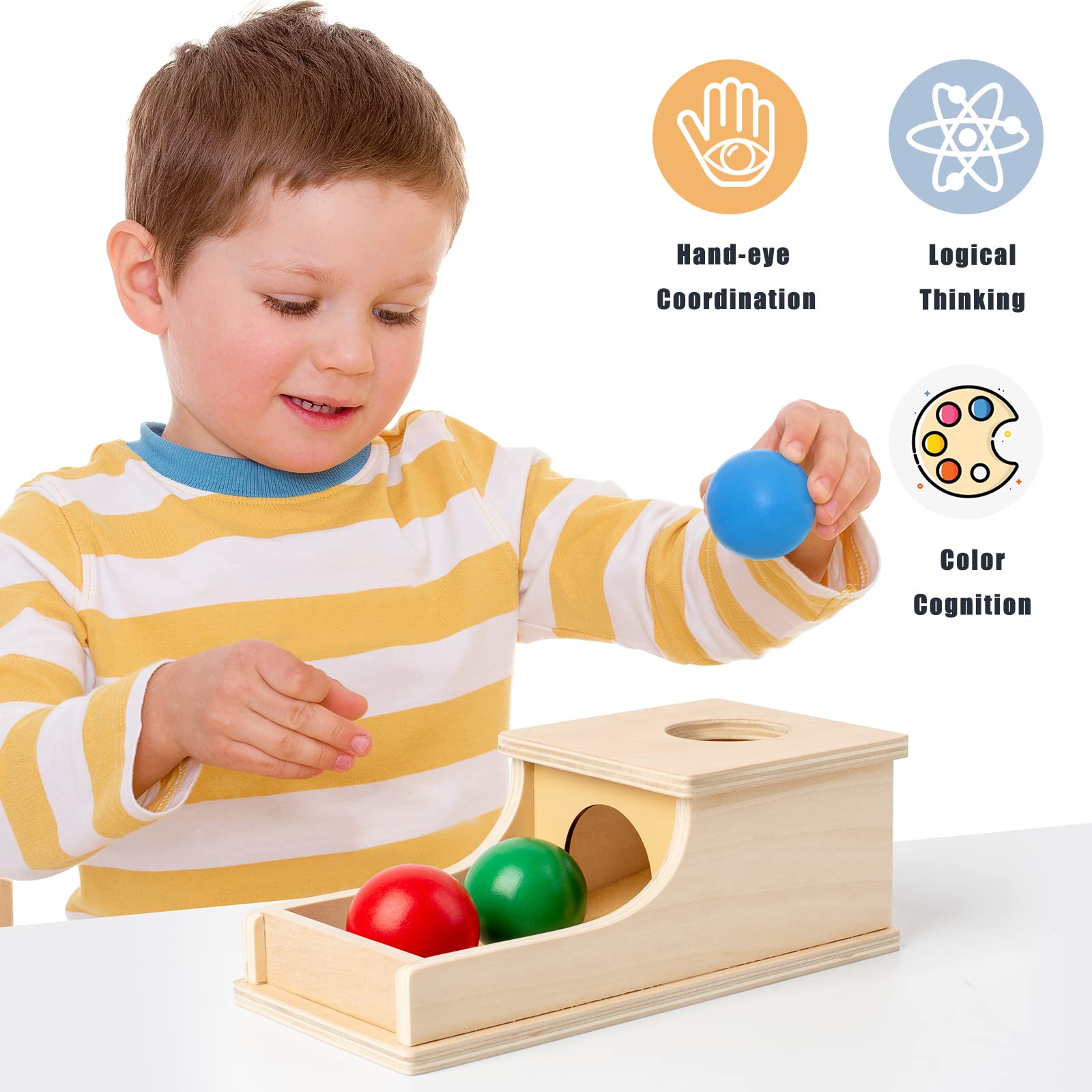 Busy edition box with tray demonstrates object permanence through drop-and-find play.