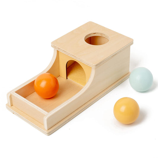 Busy Edition object permanence box with wooden tray promotes early coordination.