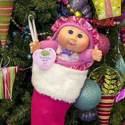 Cabbage Patch Kids doll includes an adoption birth announcement tag for memories.