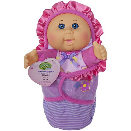 Cabbage Patch Kids newborn doll with blue eyes in a soft swaddle, ready for cuddling.
