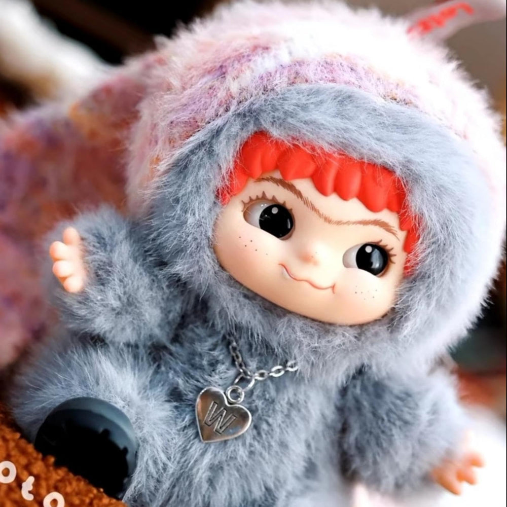 CALEMBOU Wakuku doll showing attached eyebrows for expressive charm.