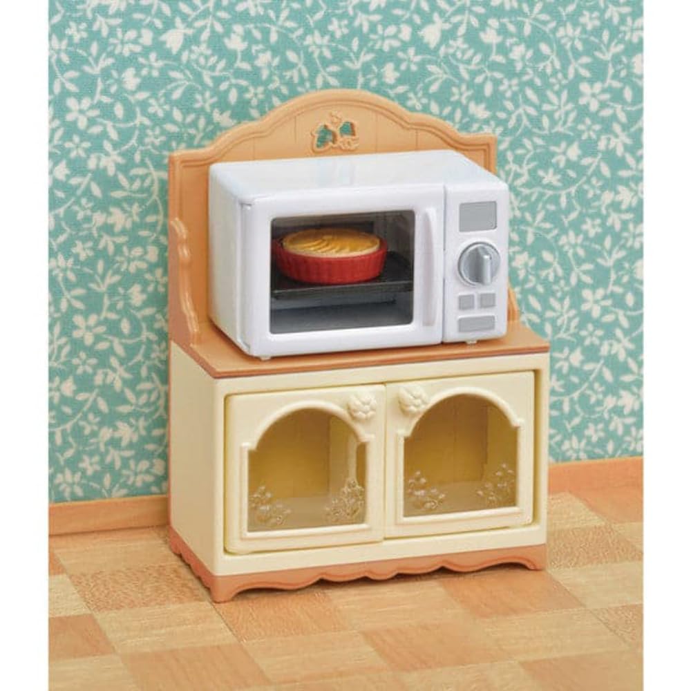 Calico Critters kitchen-detailed accessories enhance imaginative kitchen setups beside the cabinet.
