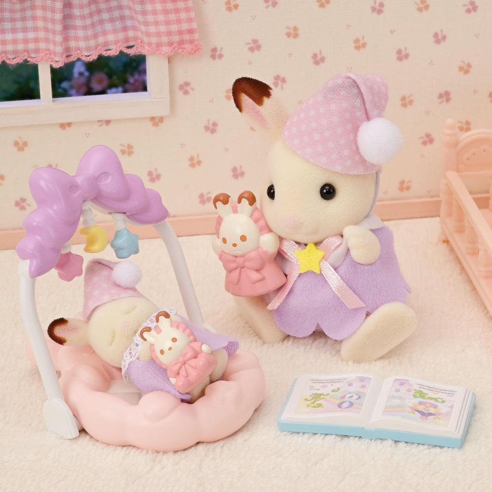 Calico Critters Sleepy Dream Siblings cradled baby with baby gym inspires soothing pretend moments.