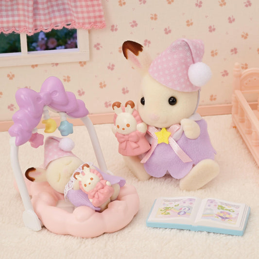 Calico Critters Sleepy Dream Siblings cradled baby with baby gym inspires soothing pretend moments.