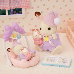 Calico Critters Sleepy Dream Siblings cradled baby with baby gym inspires soothing pretend moments.