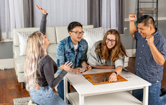 Calliope Tsuro on a coffee table during a lively game night.