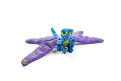Flutter The Dragonfly weighted plush on a lap for calming pressure.