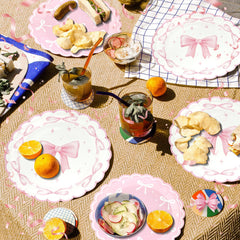 CANREVEL Bow party table setup showcases bright colors and coordinated dinnerware.