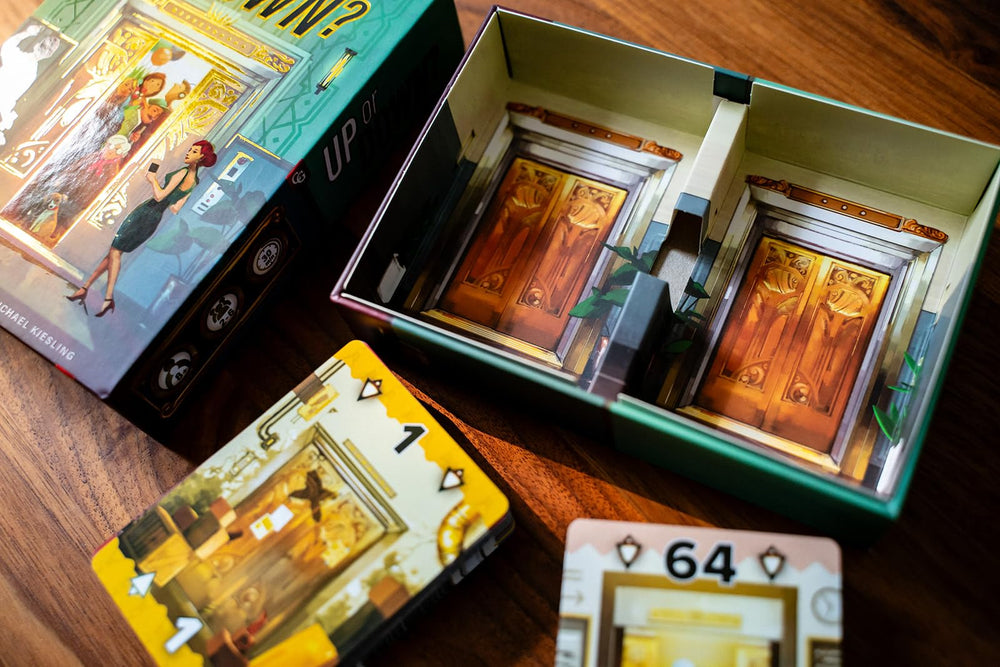 Capstone Games Up or Down players-around-table captures social play for 2–6 participants.