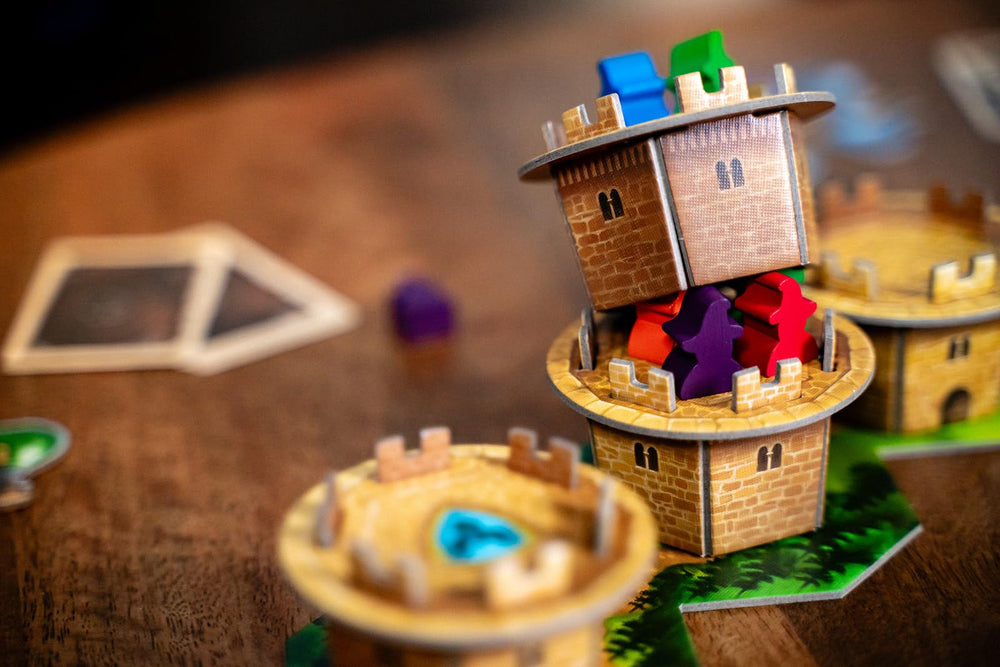 Capstone Wandering Towers components shown for family-friendly fantasy strategy.