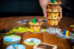 Capstone Wandering Towers wizard meeples clearly identify players on the board.