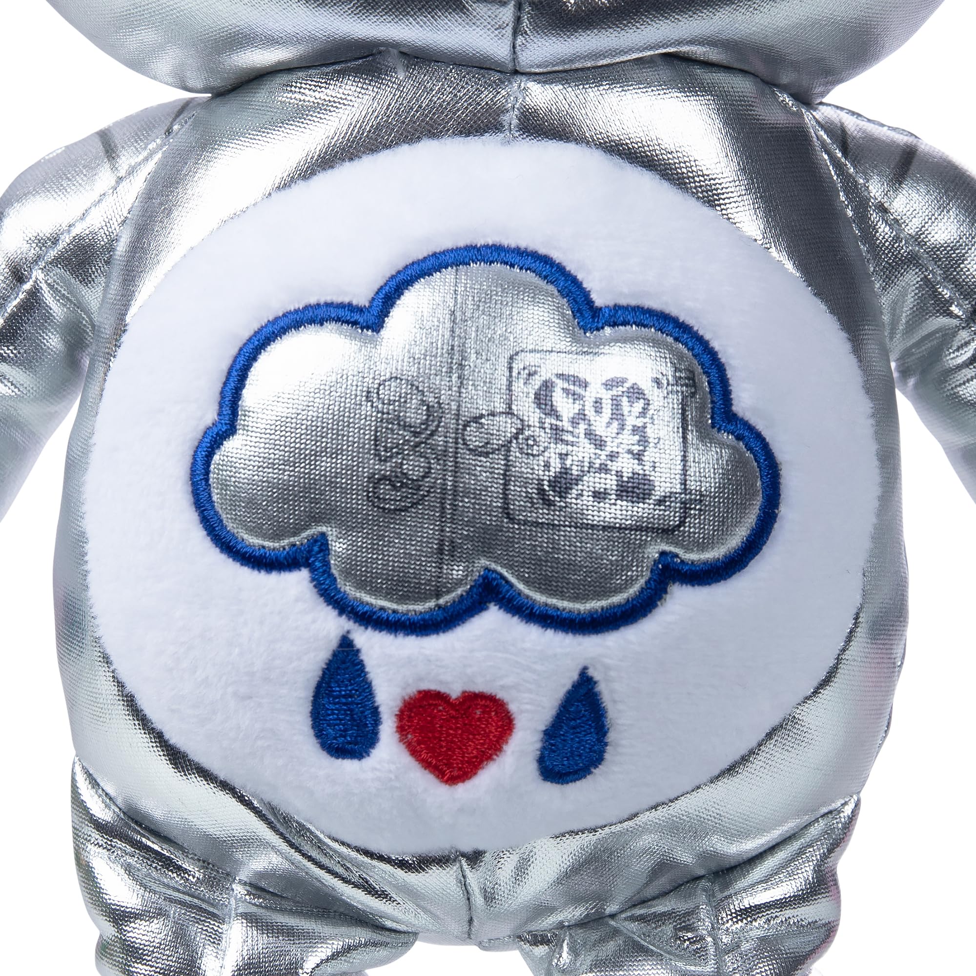 Care Bears Grumpy Bear belly badge inner workings, collectible charm for Wicked fans.