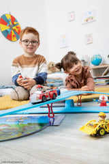Two-player action supports sharing and social play for siblings.