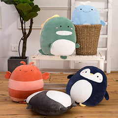 CASAGOOD penguin pillow resting on a bed creates a cozy reading corner.