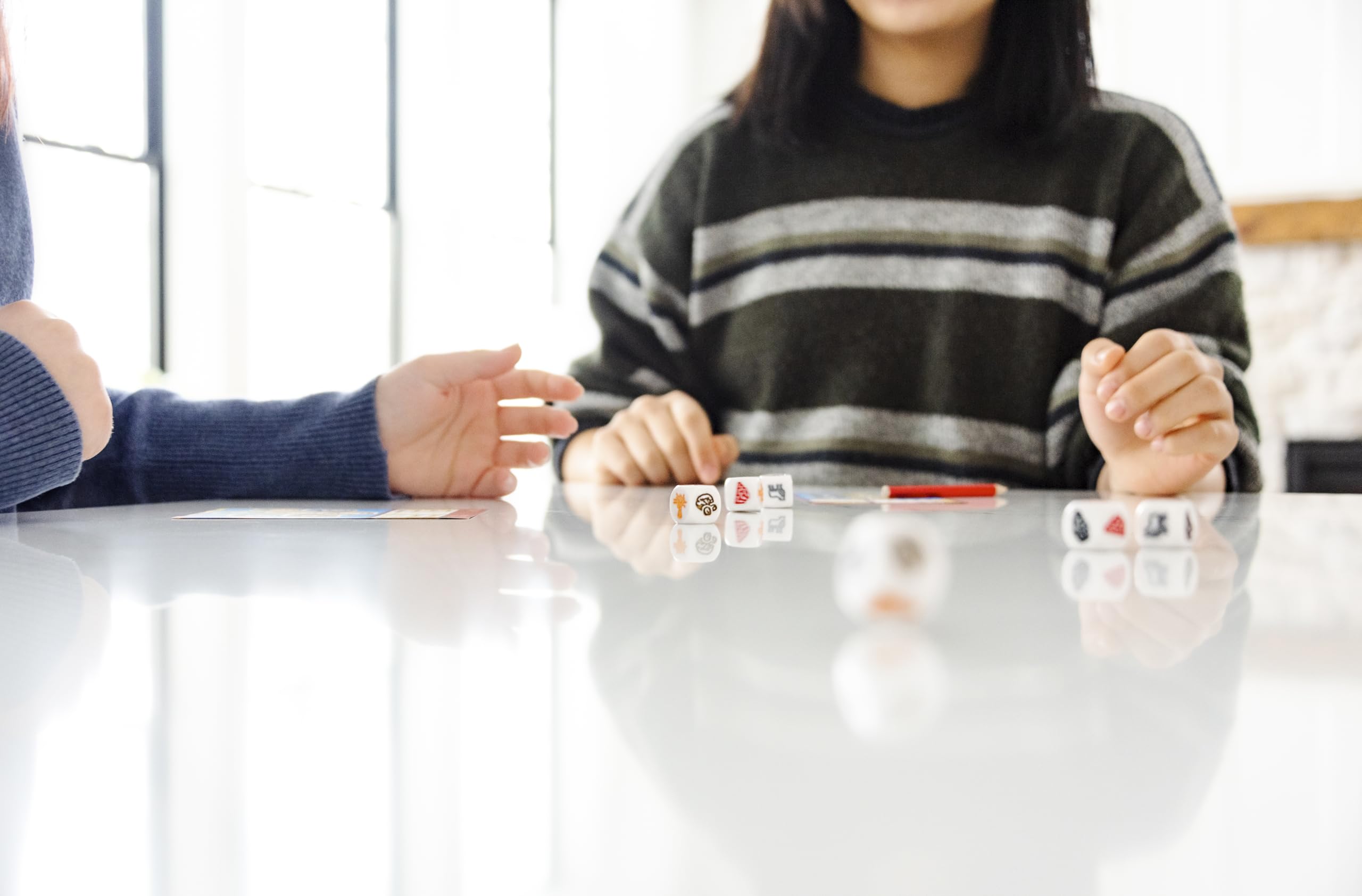 CATAN Dice Game scene with family illustrating approachable setup for kids.