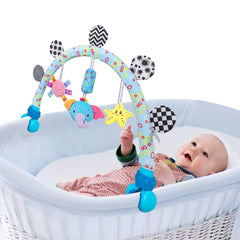Caterbee Travel Arch Bassinet with elephant toy for on-the-go play.