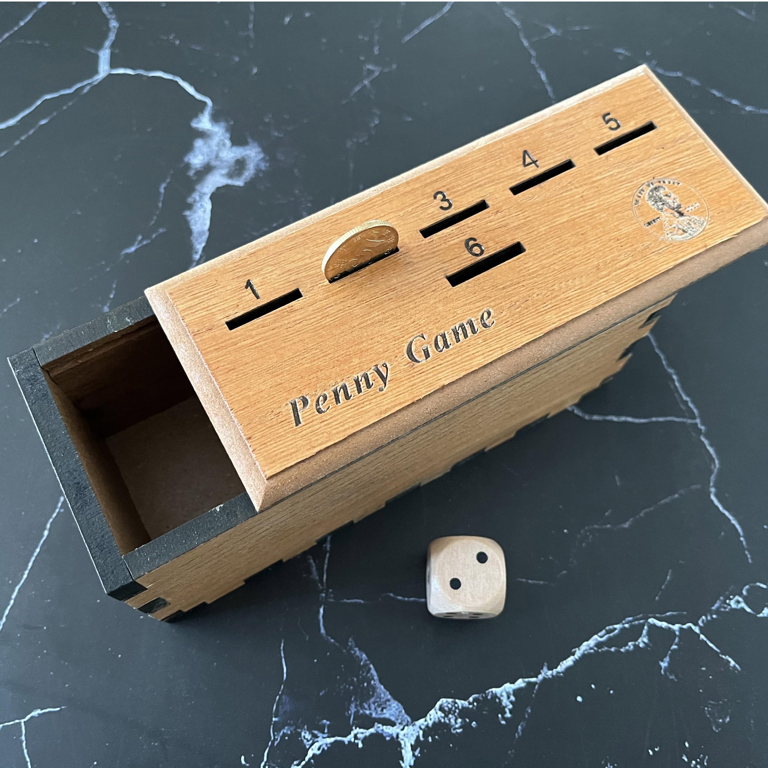 CBLKUS Penny Game wooden box interior, tactile coins enhance play