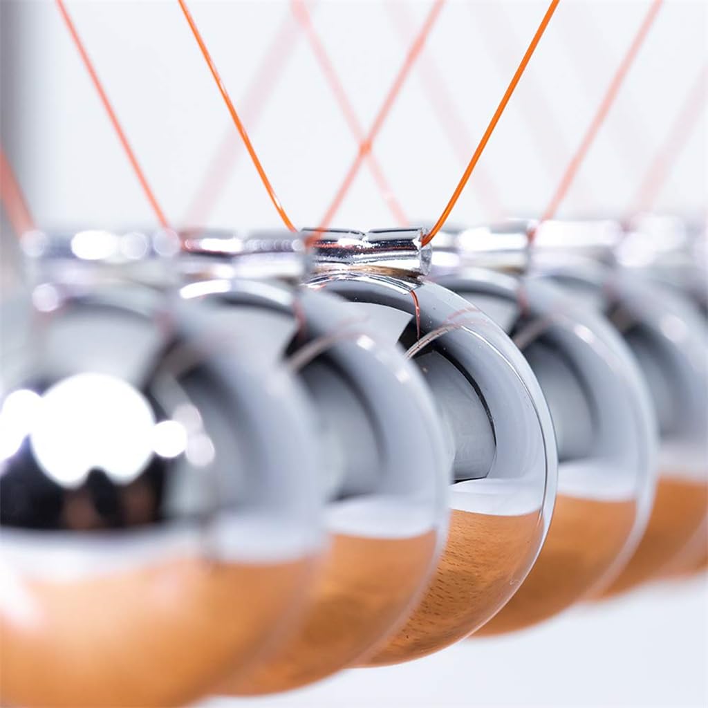 CERROPI Newtons cradle close-up finish emphasizing polished surfaces
