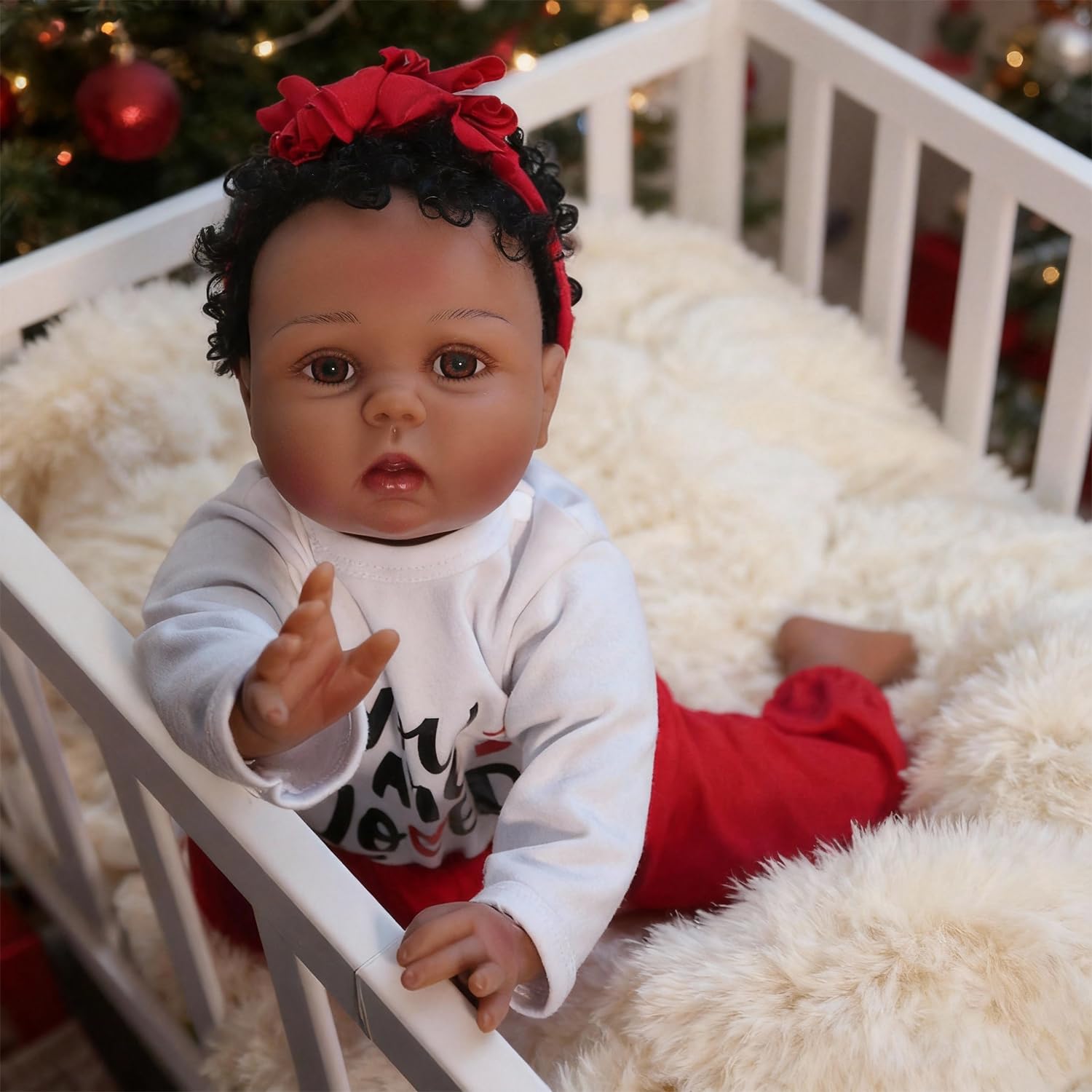 CHAREX Reborn black doll with hand-painted facial details.