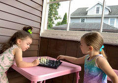 Travel-ready Chess Armory set packed in a backpack.