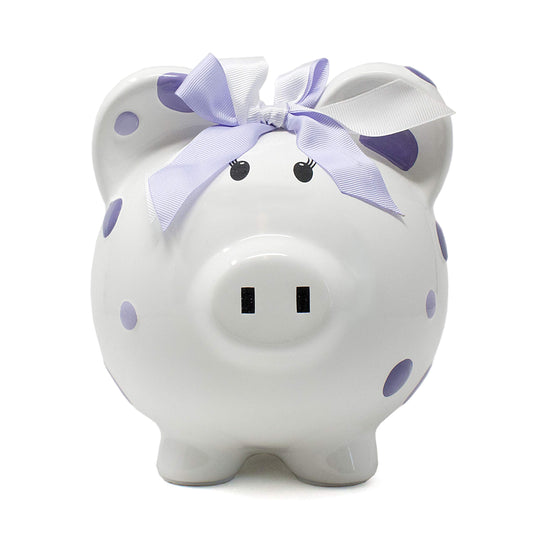 Child to Cherish piggy bank with purple polka dots for nursery decor and saving.