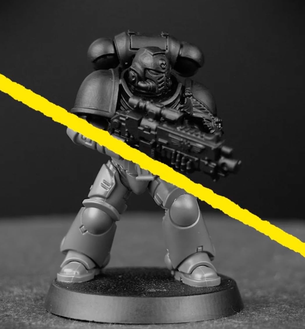 Citadel Chaos Black spray delivers consistent base tones for washes and highlights.