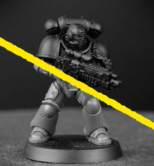 Citadel Chaos Black spray delivers consistent base tones for washes and highlights.