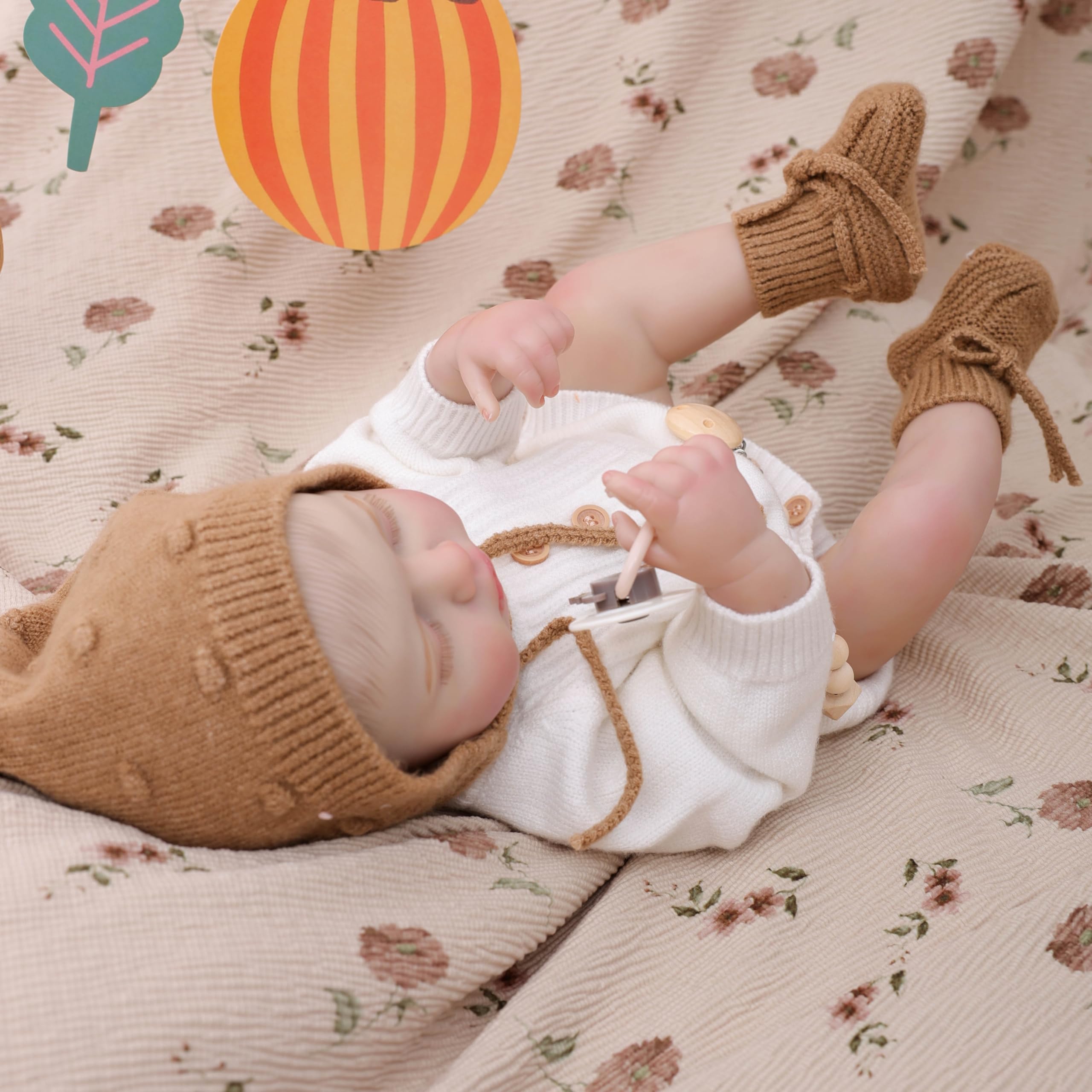 Cloveray Reborn doll accessories including bottle and pacifier.