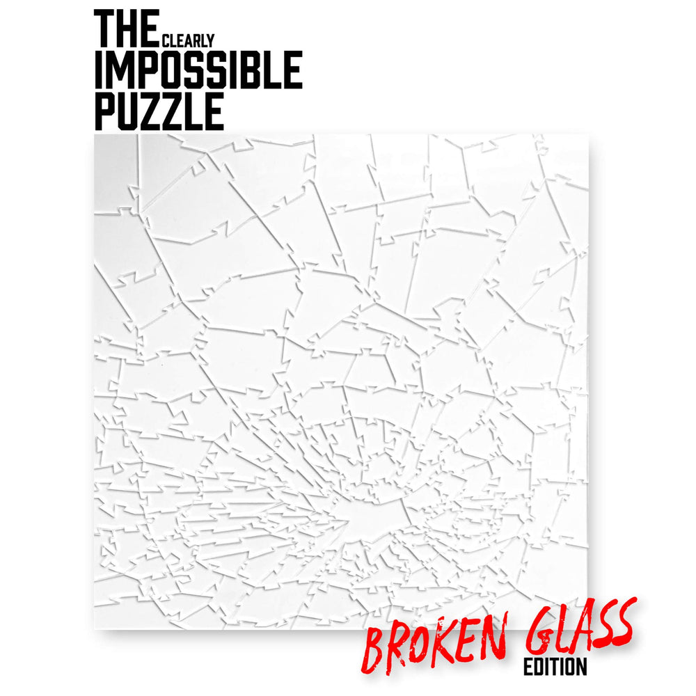 CM Originals Broken Glass Puzzle pieces spread out, highlighting the unique clear format for a challenging session.