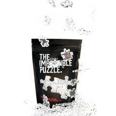 CM Originals Clearly Impossible puzzle in hand, demonstrates the 18.75 by 11 inch size.