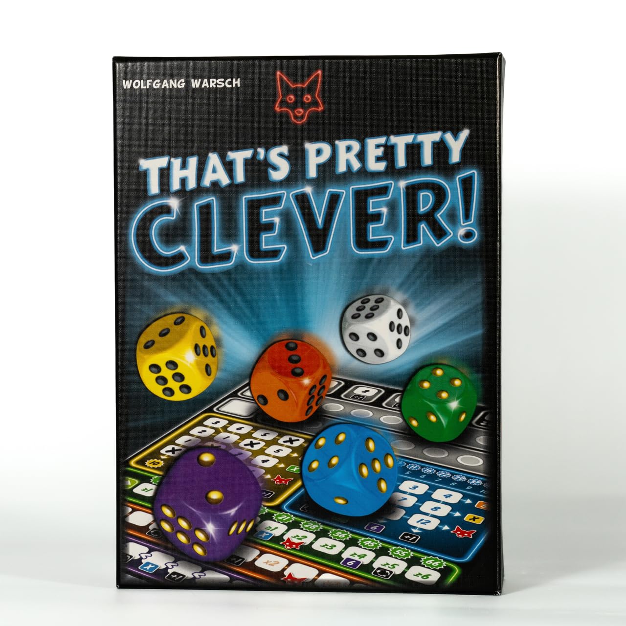 CMYK That's Pretty Clever dice on the board during family game night.