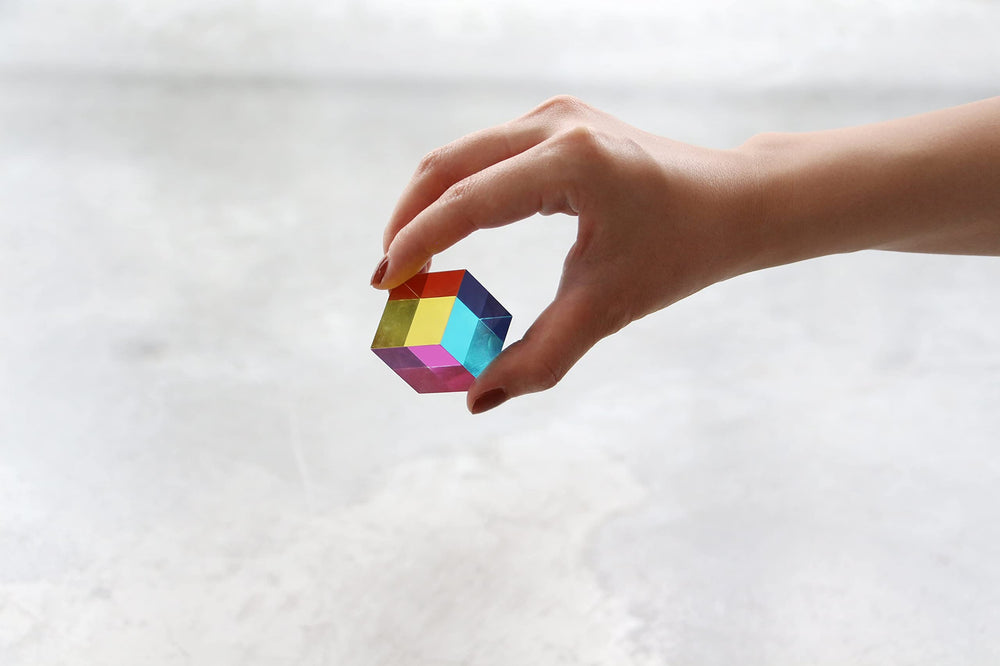 CMY Cubes Mini shows subtractive color mixing through manipulation