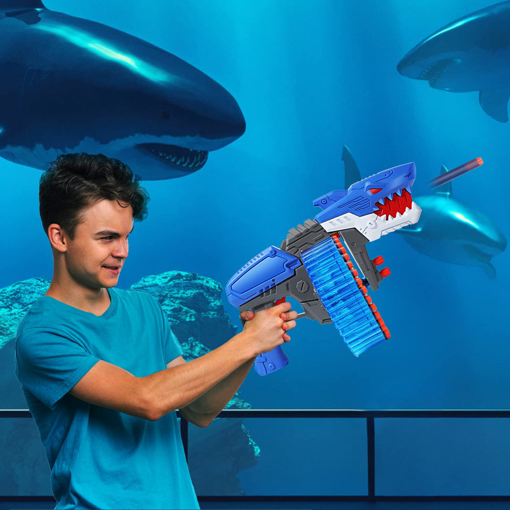 ColdFire kid playing indoors with shark-themed toy gun for family fun.