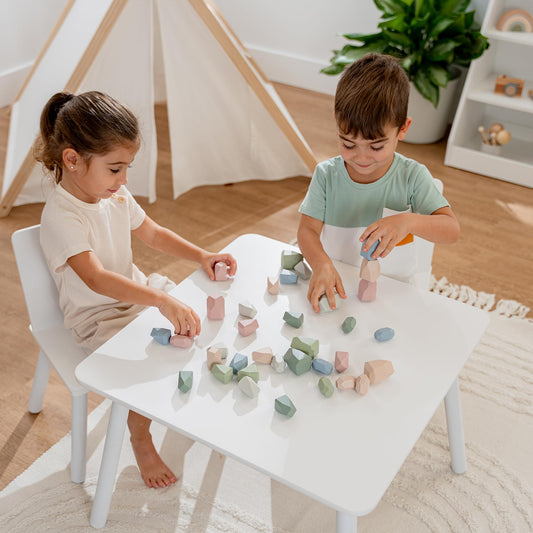 Colorful rock towers form with Comfy Cubs stacking rocks for early balance