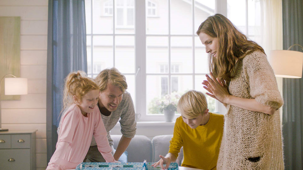 Conclave ICECOOL family game night captures group interaction and shared laughter.