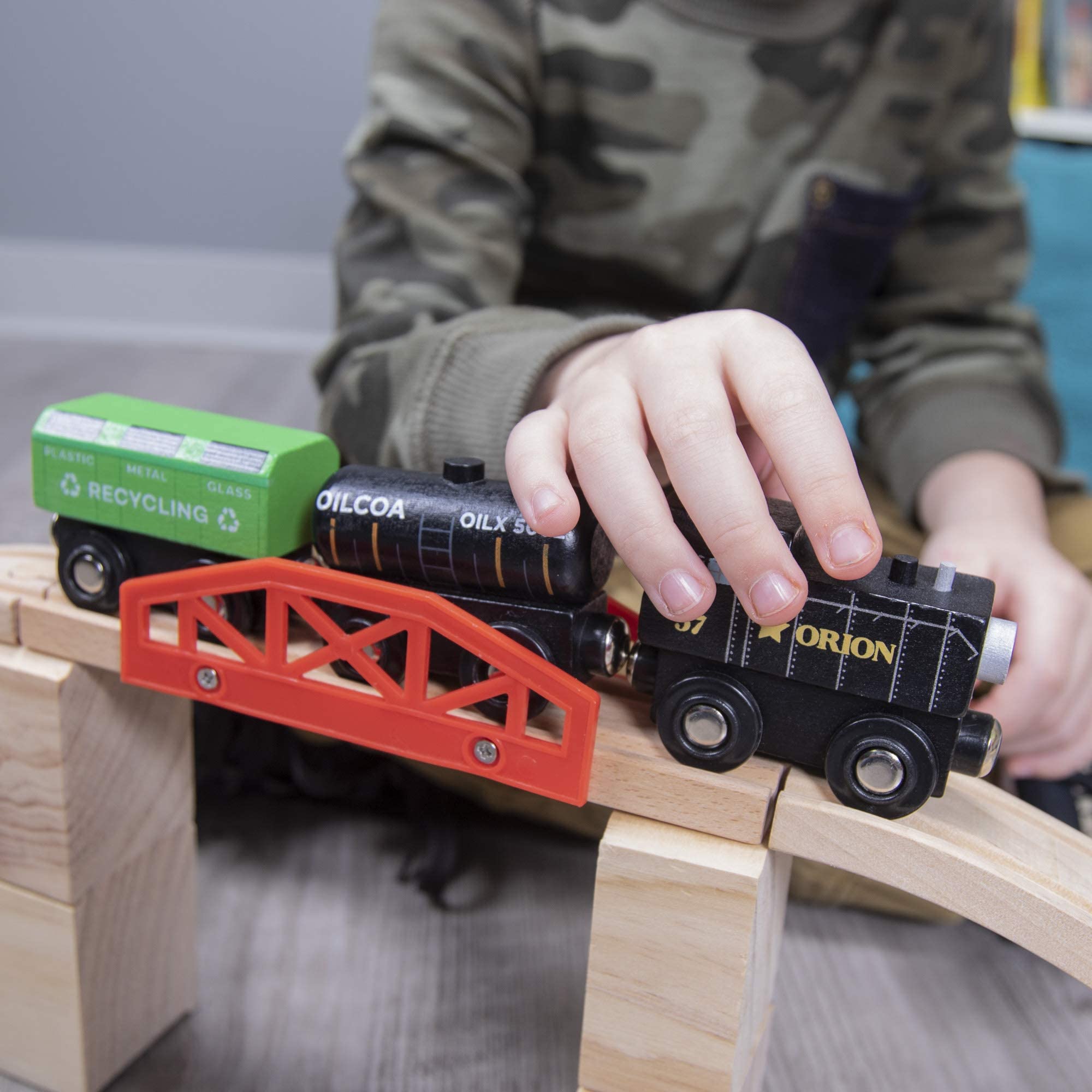 Conductor Carl wood riser 2.5-inch piece helps create layered train worlds.