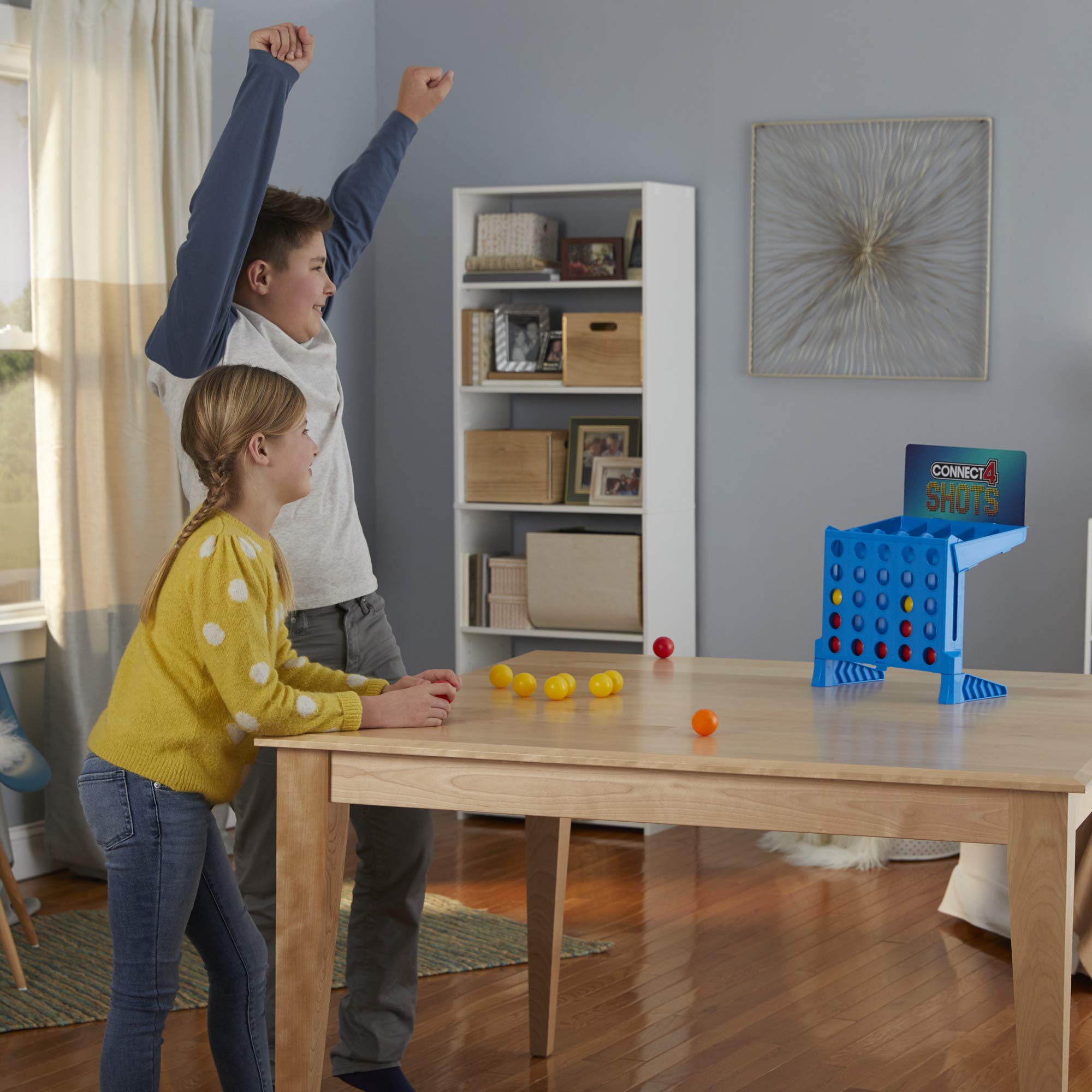 Connect 4 Shots vibrant balls add visual excitement to play.