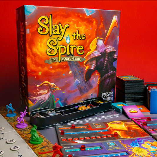 Contention Games' Slay The Spire deck of cards laid out for strategic planning.