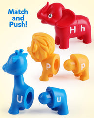A child places animal pieces, supporting fine motor skills and tactile alphabet practice.