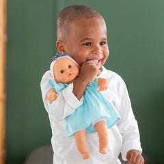 Corolle Bébé Calin Maud held in arms for comforting play.